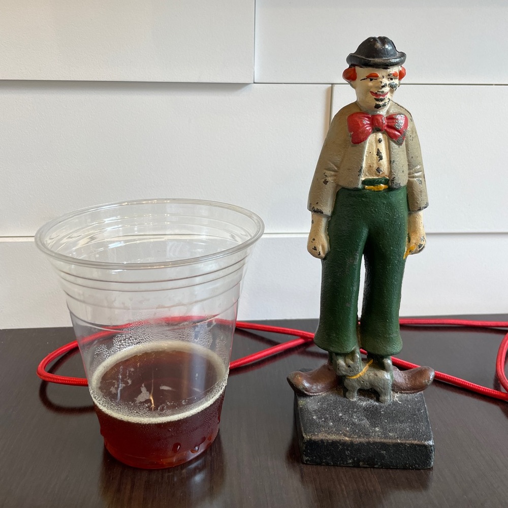 Solid cast iron clown w dog